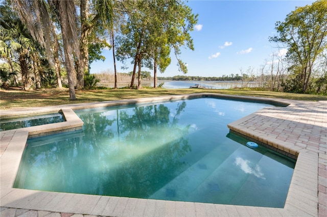 view of pool featuring a water view