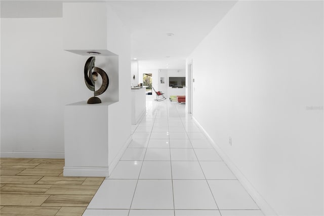 hallway with light tile patterned flooring