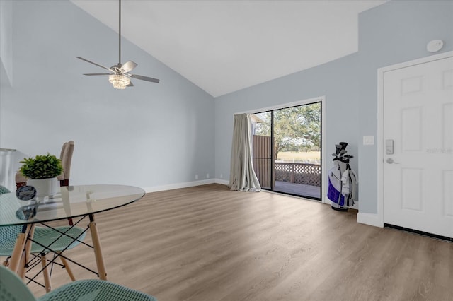 entrance foyer featuring ceiling fan, light hardwood / wood-style flooring, and high vaulted ceiling