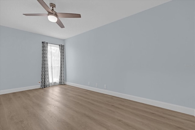 unfurnished room with ceiling fan and light hardwood / wood-style floors