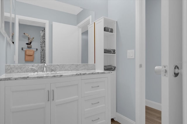 bathroom featuring hardwood / wood-style floors and vanity