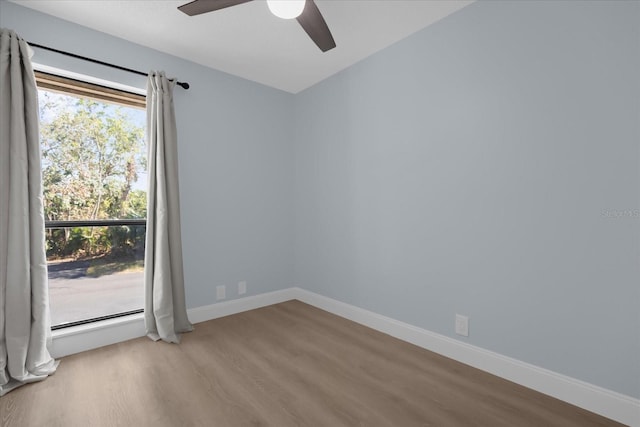 unfurnished room featuring ceiling fan and hardwood / wood-style flooring