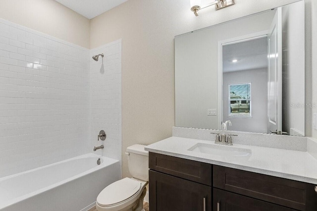 full bathroom featuring vanity, shower / washtub combination, and toilet