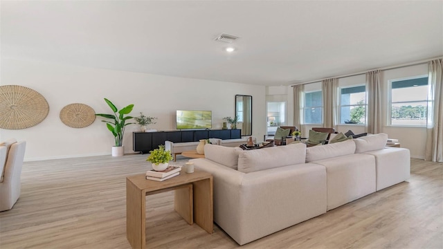 living room with light hardwood / wood-style floors