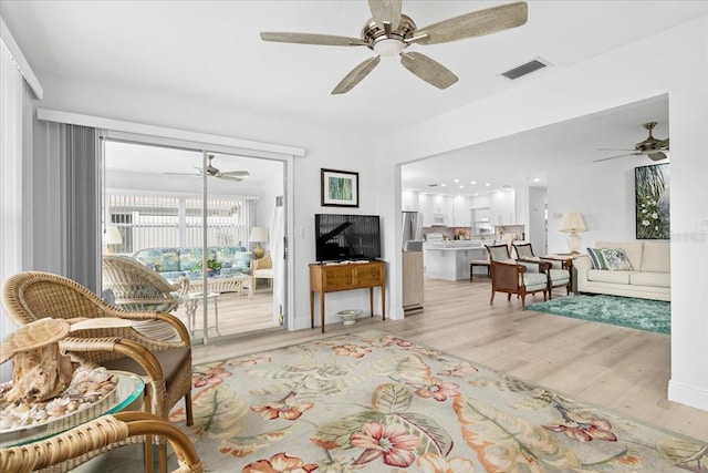 living room with light hardwood / wood-style floors