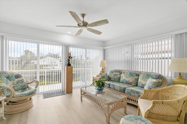 sunroom with plenty of natural light and ceiling fan