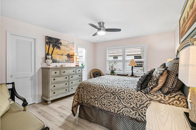 bedroom featuring light hardwood / wood-style floors and ceiling fan