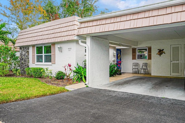 view of front of property with a carport