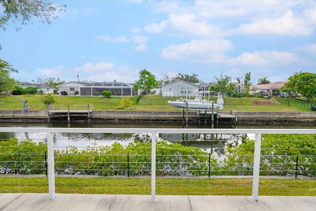 exterior space featuring a dock and a water view