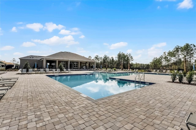 view of swimming pool with a patio