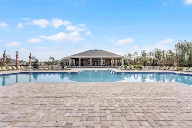 view of swimming pool featuring a patio area