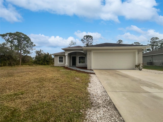 view of front of home featuring a front yard and a garage