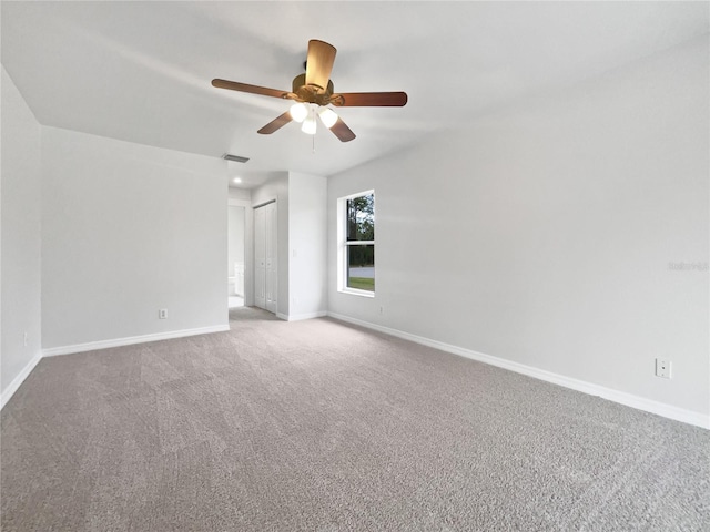 spare room with carpet flooring and ceiling fan