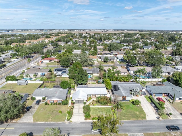 birds eye view of property with a residential view