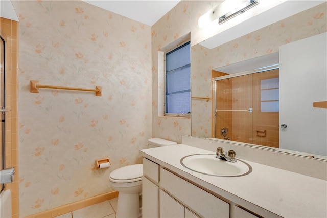 bathroom featuring vanity, baseboards, wallpapered walls, tile patterned flooring, and toilet