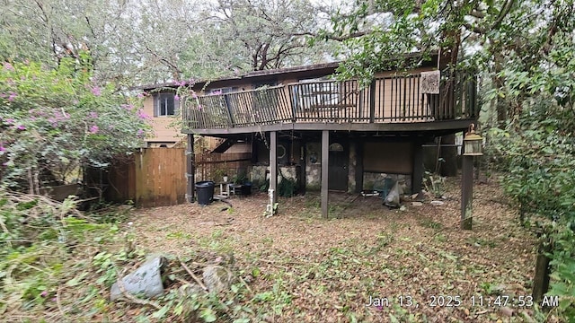 back of house featuring a wooden deck