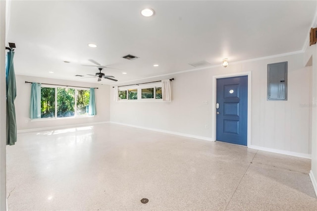 interior space featuring ornamental molding, electric panel, and ceiling fan