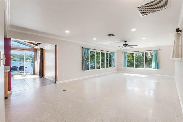 empty room with ceiling fan and ornamental molding