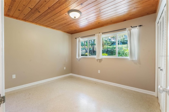 spare room featuring wood ceiling