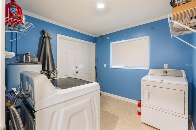 laundry room with crown molding, independent washer and dryer, and water heater