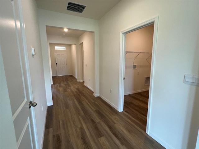 hallway featuring dark hardwood / wood-style flooring