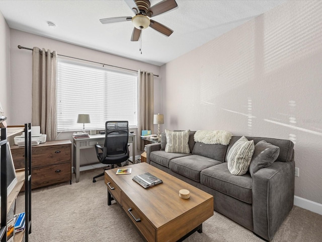 living room with ceiling fan and light colored carpet