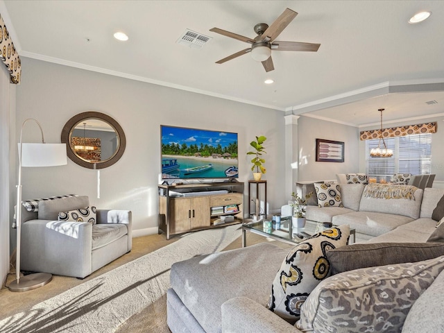 carpeted living room featuring ceiling fan with notable chandelier and ornamental molding