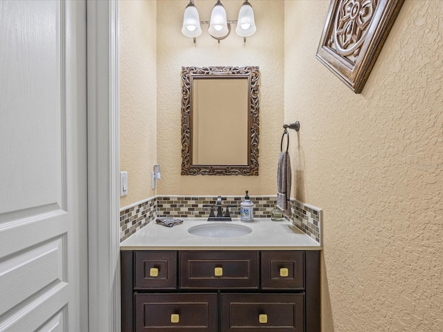 bathroom with vanity and backsplash