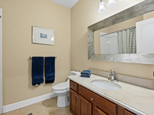 bathroom with tile patterned flooring, vanity, a shower with shower curtain, and toilet