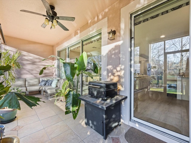 exterior space featuring an outdoor hangout area and ceiling fan