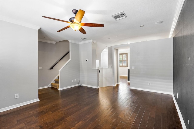 unfurnished living room featuring crown molding, dark hardwood / wood-style floors, and ceiling fan