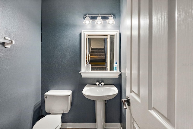 bathroom featuring sink and toilet