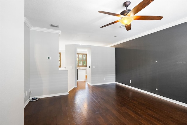 unfurnished living room with crown molding, dark hardwood / wood-style floors, and ceiling fan