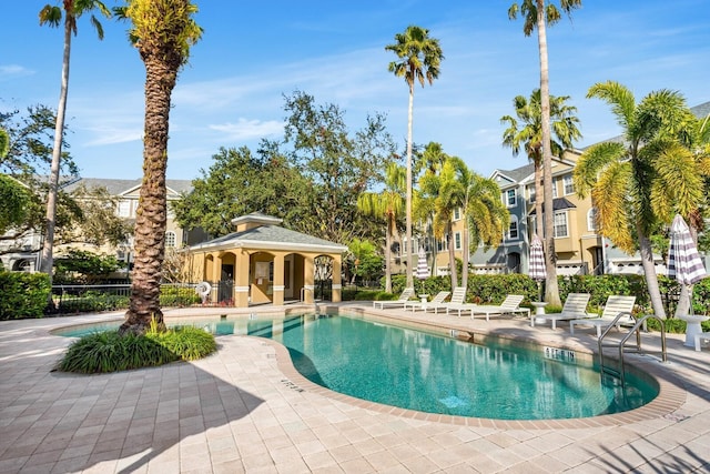 view of swimming pool with a gazebo and a patio