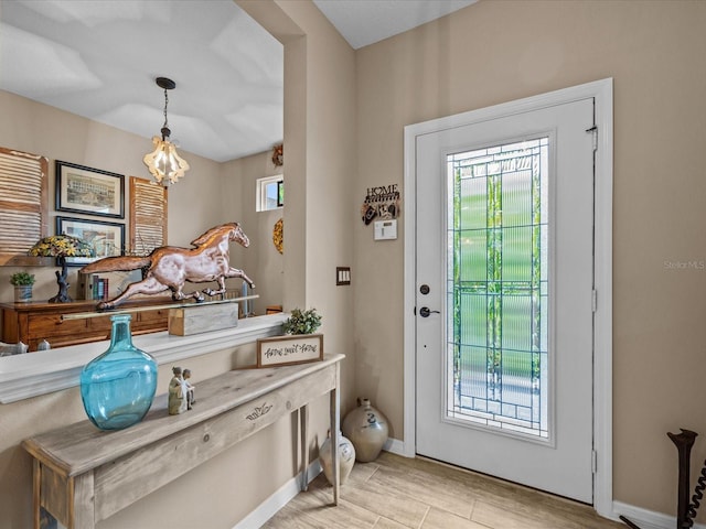 doorway to outside featuring light hardwood / wood-style flooring