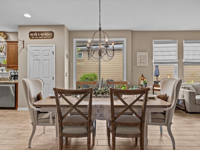 dining space featuring a notable chandelier