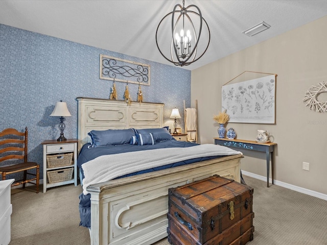 carpeted bedroom with an inviting chandelier