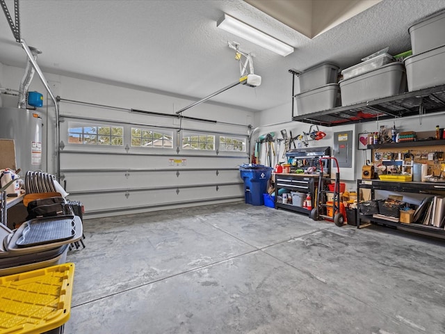 garage featuring a workshop area, water heater, and a garage door opener