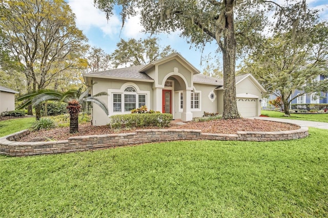 single story home featuring a garage and a front yard