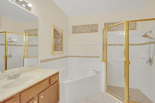 bathroom featuring vanity, tile patterned floors, and separate shower and tub