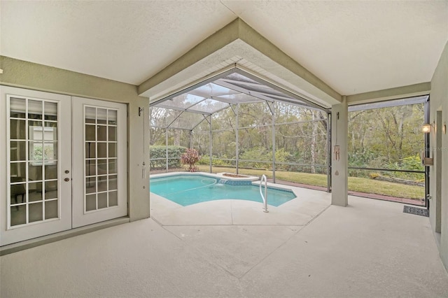 view of pool featuring a patio, a hot tub, french doors, and glass enclosure