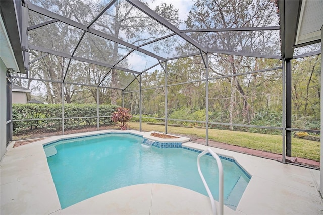 view of pool featuring a patio, a lanai, and a lawn