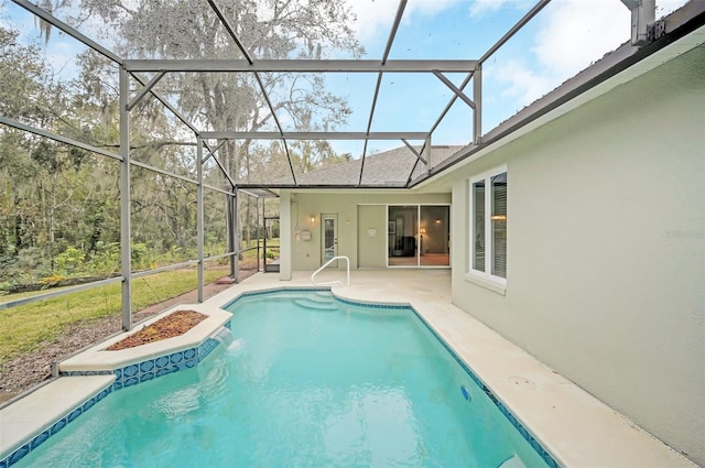 view of pool featuring a patio and glass enclosure