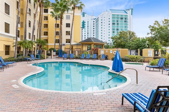 view of swimming pool featuring a gazebo and a patio area