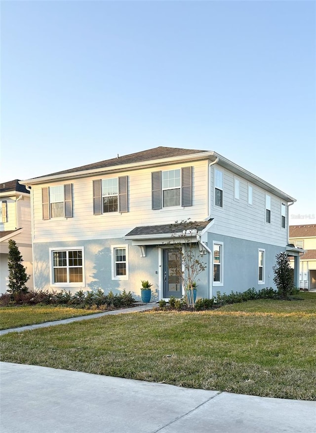 view of front of home featuring a front lawn