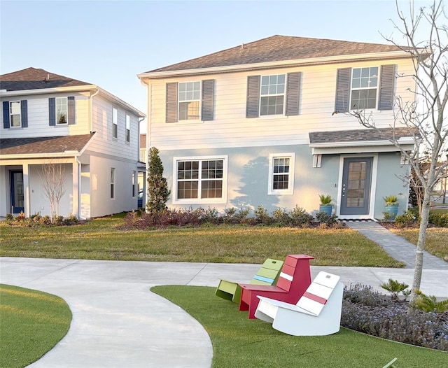 view of front of home featuring a front lawn