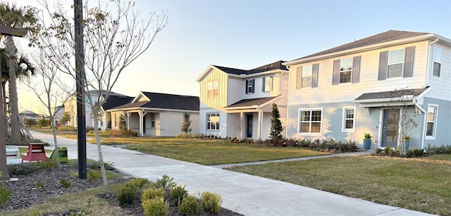 view of front of house with a yard