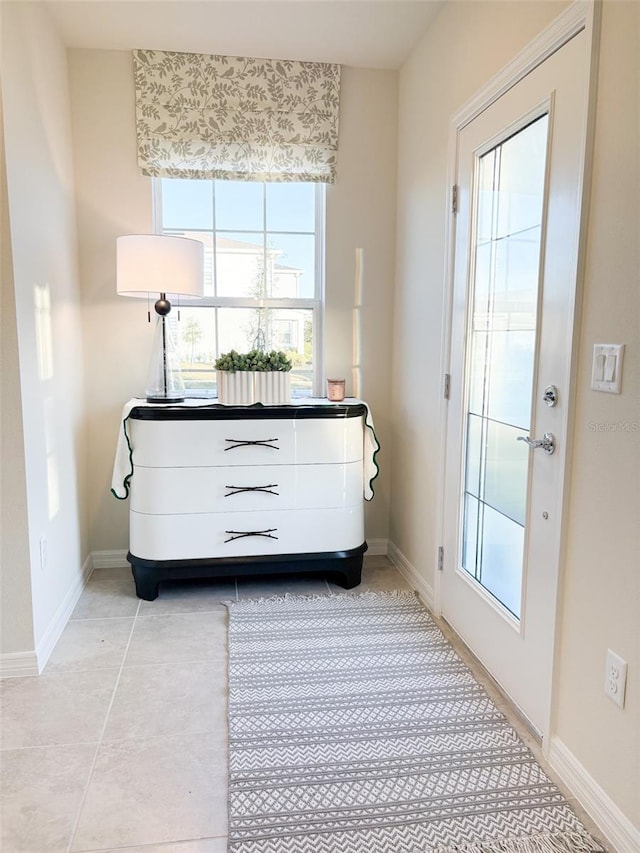 entryway featuring light tile patterned floors