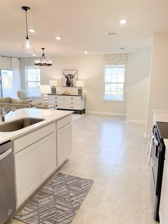 kitchen with white cabinetry, range with electric stovetop, dishwasher, pendant lighting, and sink