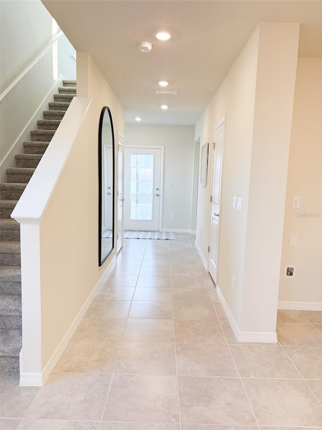 hallway featuring light tile patterned floors